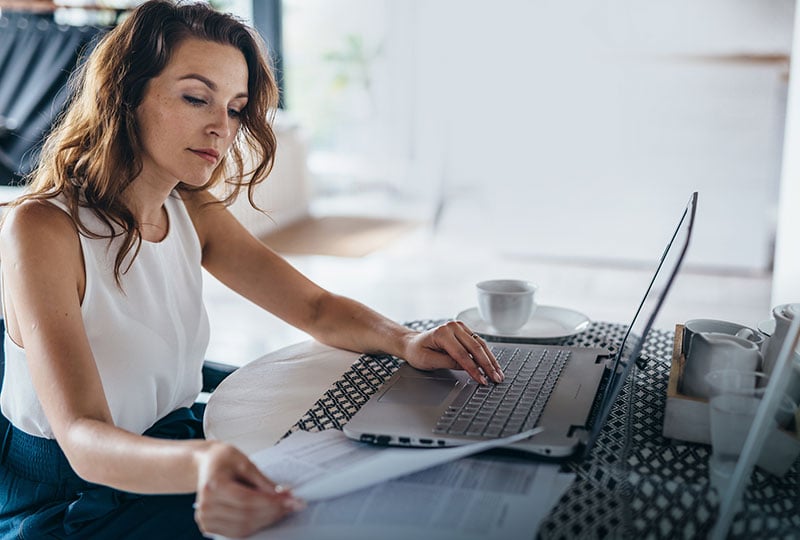 woman looking at papers