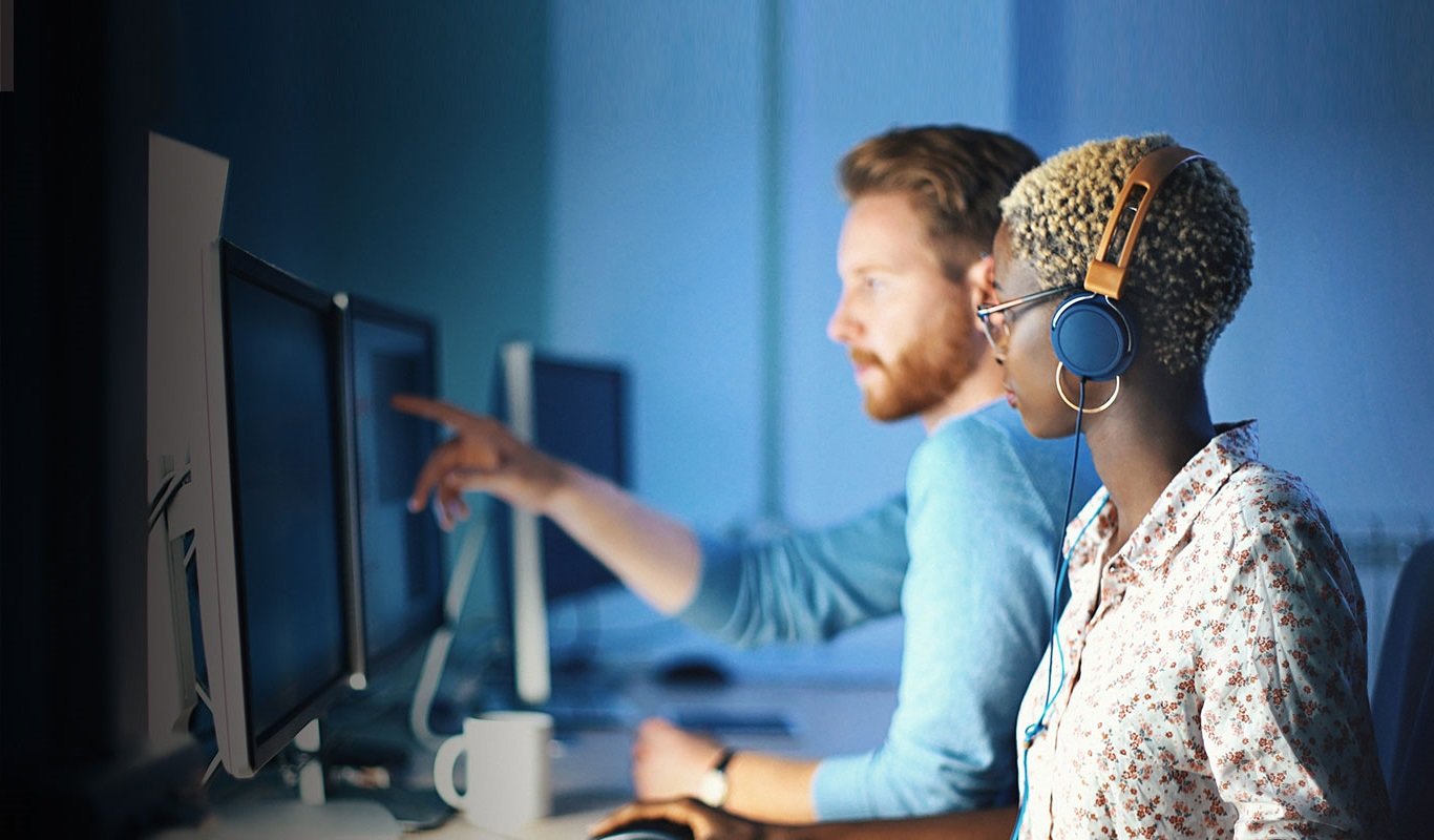 two people looking at a computer
